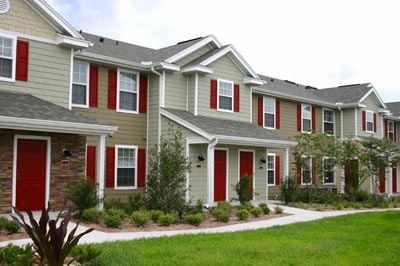 A nice subdivision condo community with a green yard