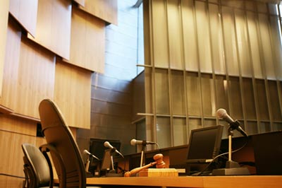 Interior of a government building with chairs and microphones