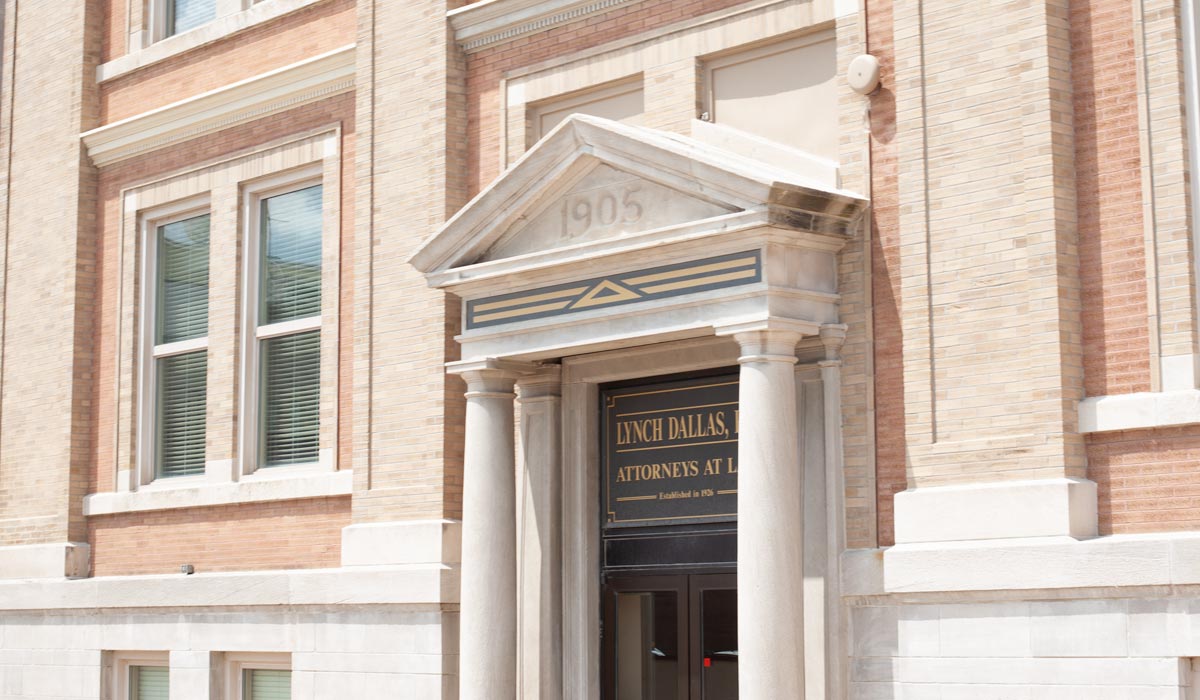 Exterior of the Lynch Dallas building with columns and a brick facade